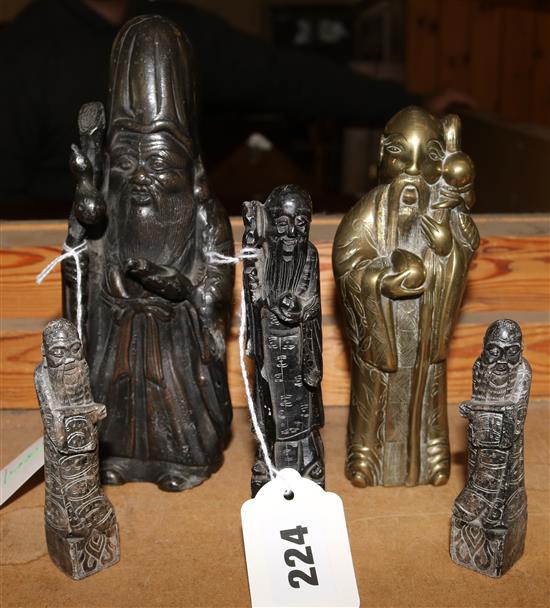 Two Chinese metal figures of Immortals and three similar soapstone seals